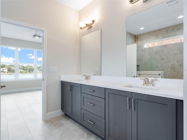 bathroom featuring ceiling fan, tile flooring, and double sink vanity