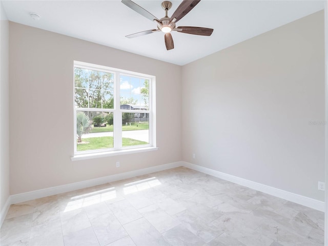 tiled empty room with ceiling fan