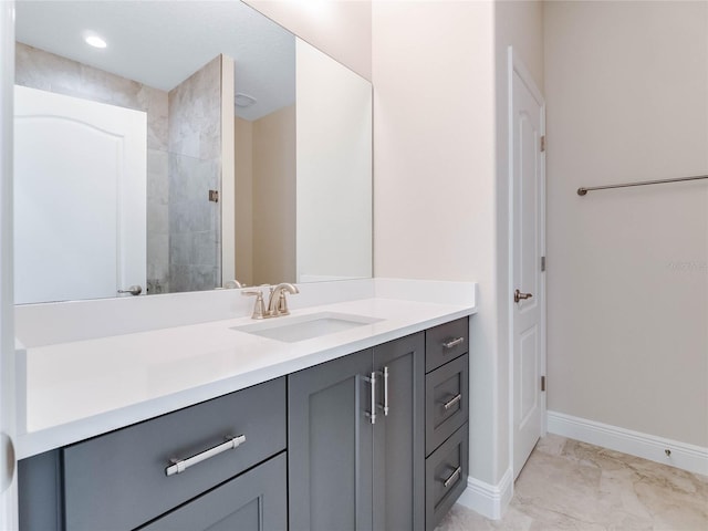 bathroom featuring tile flooring and vanity