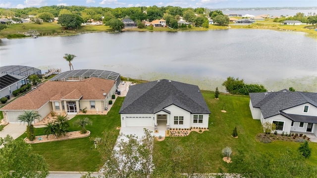 birds eye view of property with a water view