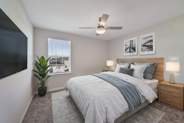 bedroom with ceiling fan and light colored carpet