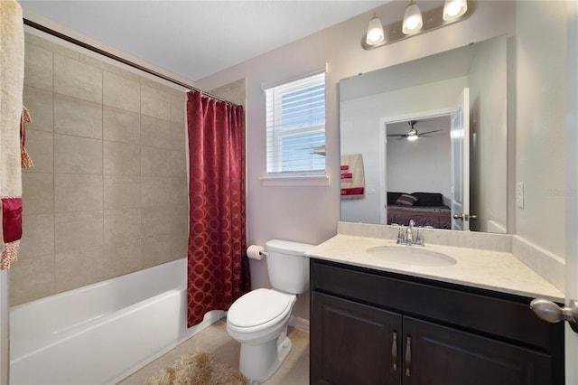 full bathroom with vanity, toilet, shower / bath combo with shower curtain, and ceiling fan