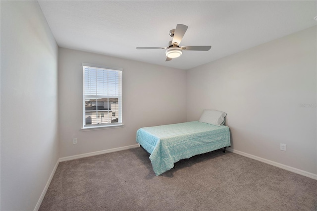 bedroom with ceiling fan and carpet flooring