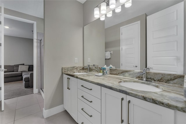 bathroom with tile flooring, double sink, a shower with door, and oversized vanity