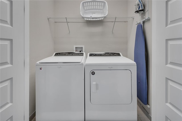 washroom featuring washer hookup and washing machine and clothes dryer