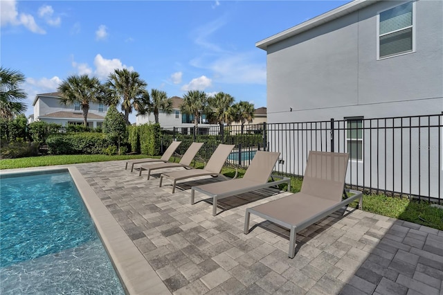 view of patio featuring a fenced in pool