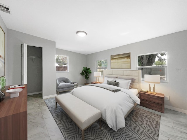 bedroom with light tile flooring and a closet