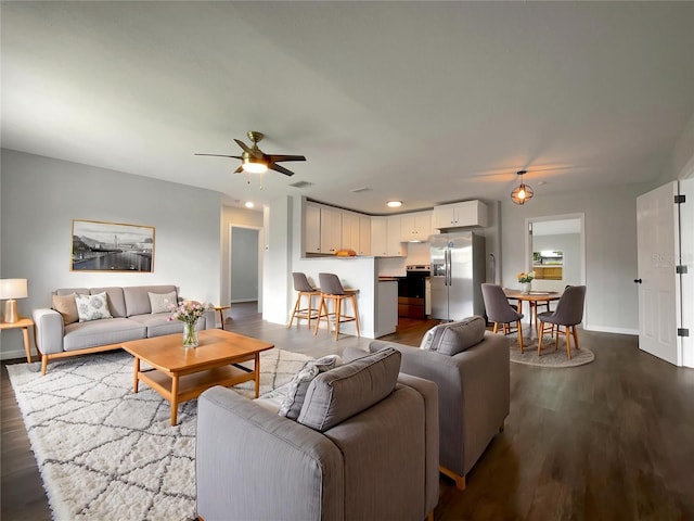 4011 Mesa Ave, Sarasota, FL 34233 - living area featuring dark wood-style flooring, a ceiling fan, and baseboards