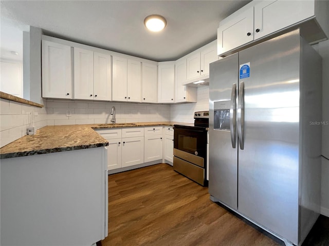 4011 Mesa Ave, Sarasota, FL 34233 - kitchen featuring appliances with stainless steel finishes, a sink, backsplash, dark wood-style floors, and white cabinets