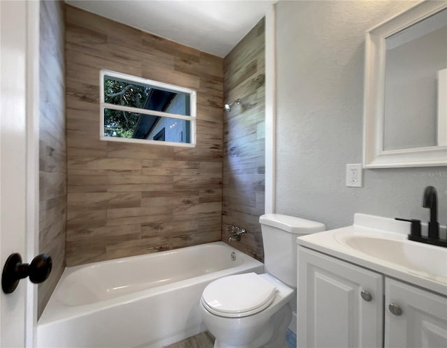 4011 Mesa Ave, Sarasota, FL 34233 - full bathroom featuring vanity, toilet, tub / shower combination, and a textured wall