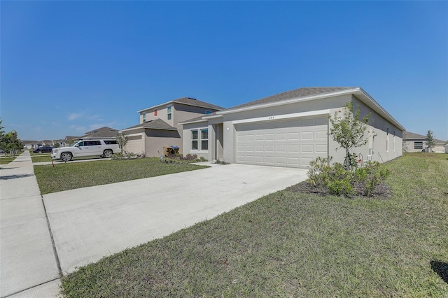 view of front of home with a front lawn and a garage