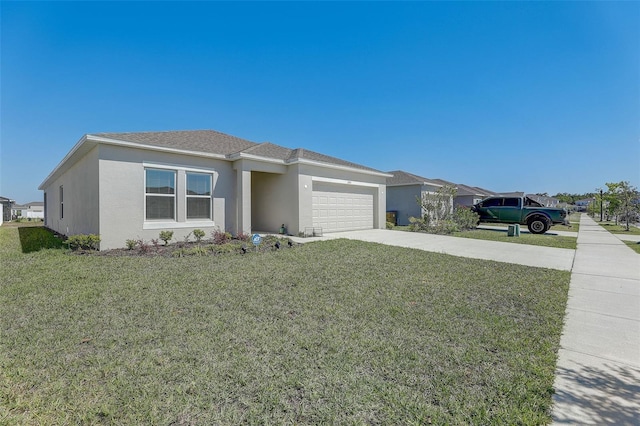 view of front of house with a front yard and a garage