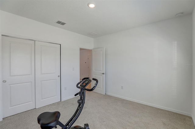 exercise area with light colored carpet