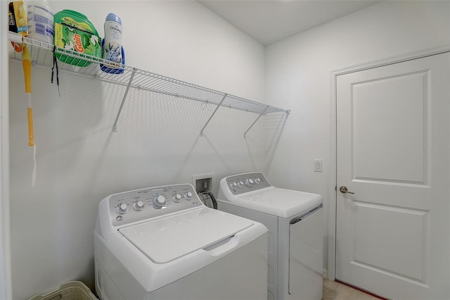 laundry room featuring hookup for a washing machine and washing machine and dryer