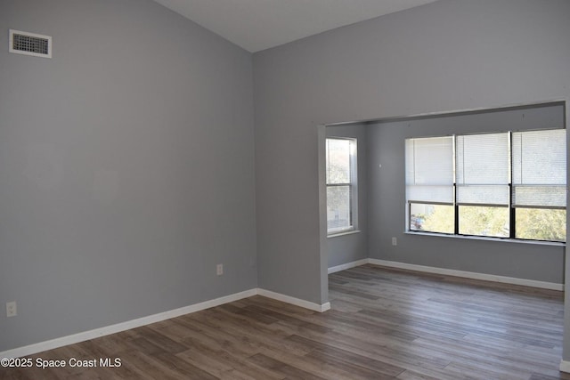 spare room with hardwood / wood-style flooring