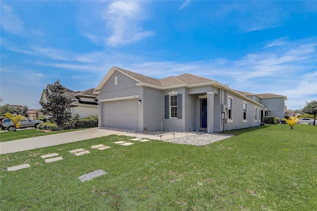 view of front of property featuring a front yard and a garage