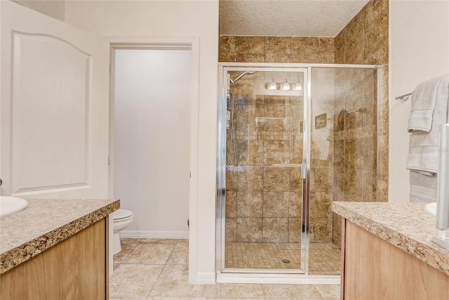 bathroom featuring toilet, vanity, a shower with shower door, and tile floors