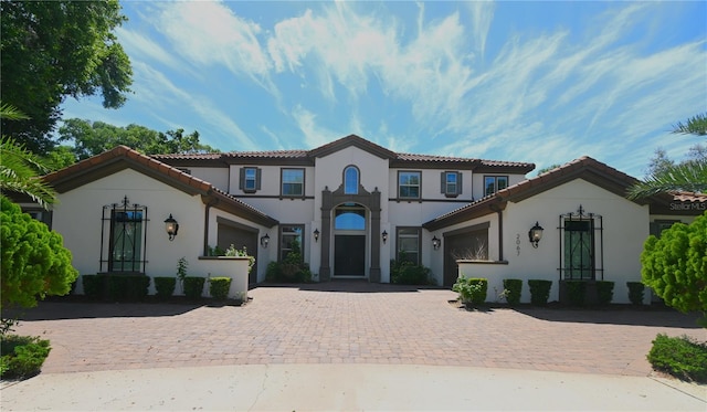 mediterranean / spanish-style house featuring a garage