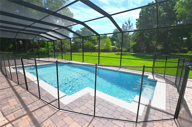 view of pool with a lanai, a yard, and a patio area