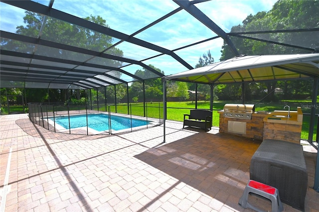 view of swimming pool featuring a patio, area for grilling, and glass enclosure