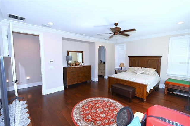 bedroom featuring ceiling fan, crown molding, and dark hardwood / wood-style floors