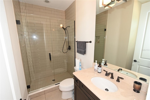 bathroom featuring a shower with shower door, vanity, toilet, and tile flooring