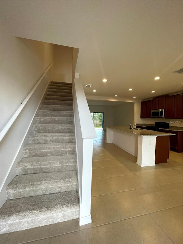 stairs with light tile floors