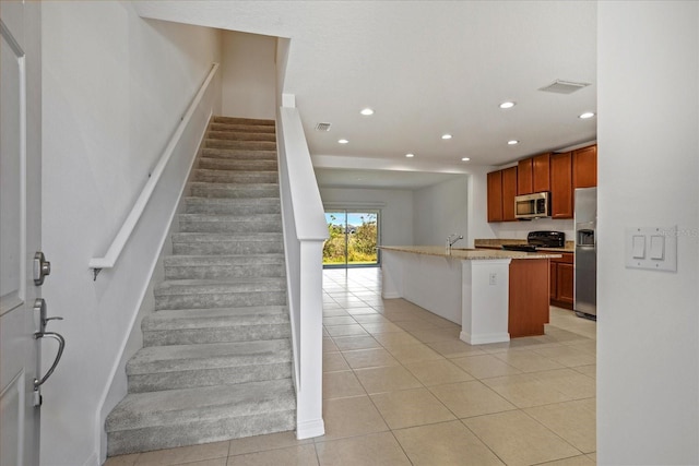 kitchen with light tile patterned floors, recessed lighting, visible vents, and appliances with stainless steel finishes