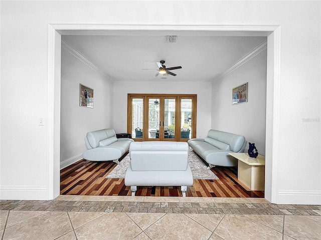 living room featuring ceiling fan, wood-type flooring, ornamental molding, and french doors