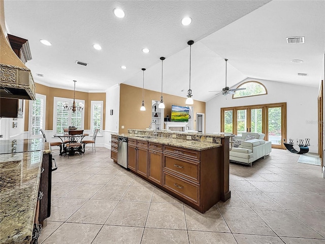 kitchen with pendant lighting, stainless steel dishwasher, a wealth of natural light, and lofted ceiling