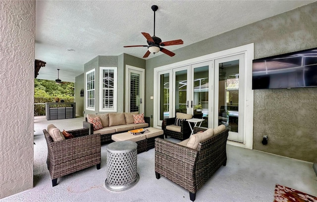 view of patio / terrace featuring outdoor lounge area, ceiling fan, and french doors