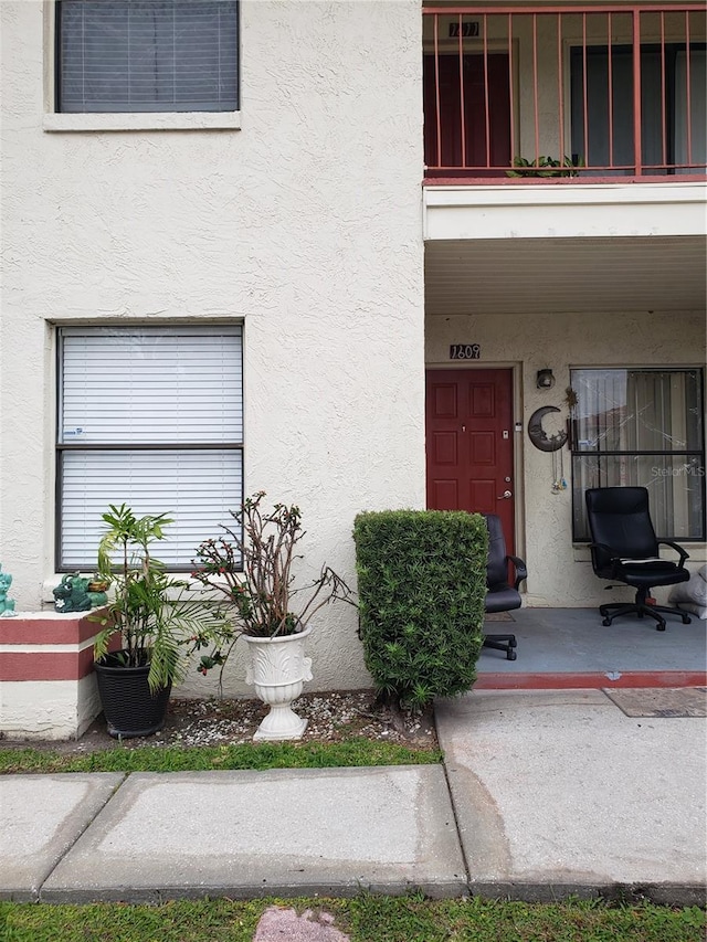 doorway to property featuring a balcony