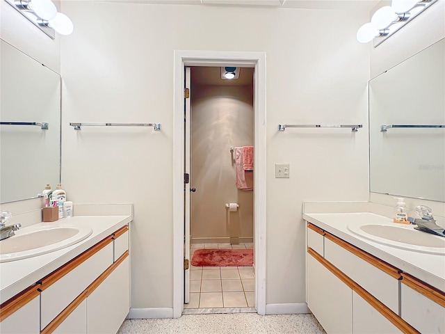 bathroom featuring vanity with extensive cabinet space