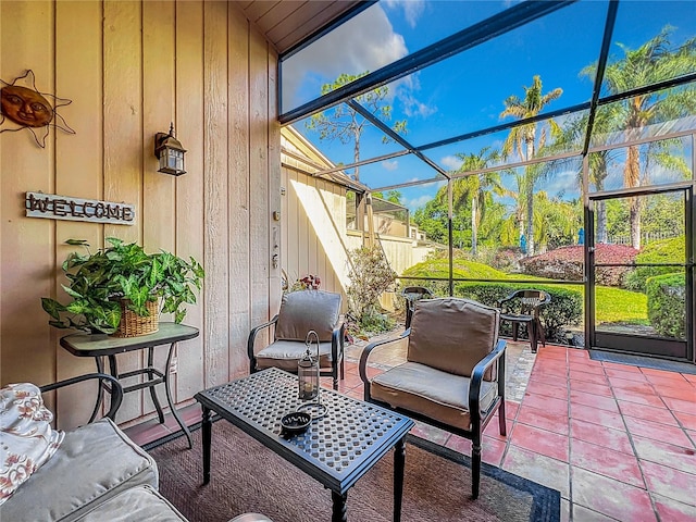 sunroom / solarium featuring lofted ceiling