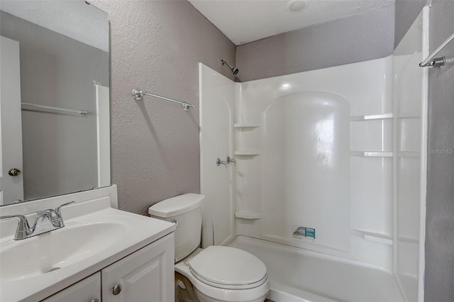 full bathroom featuring toilet, bathing tub / shower combination, and vanity