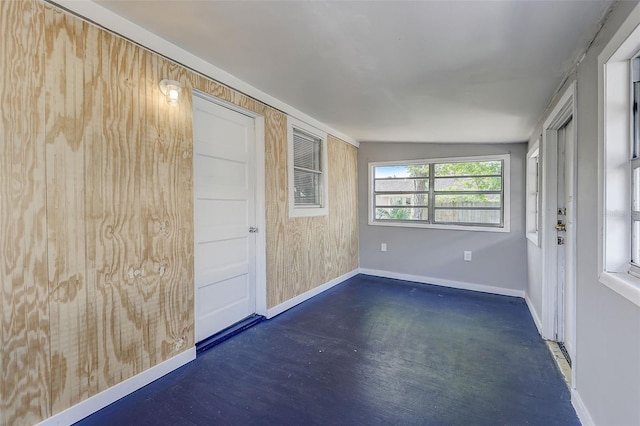 spare room with lofted ceiling