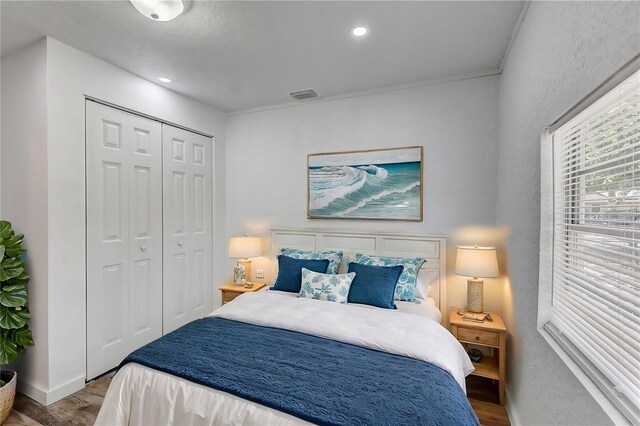 bedroom featuring a closet and light hardwood / wood-style floors