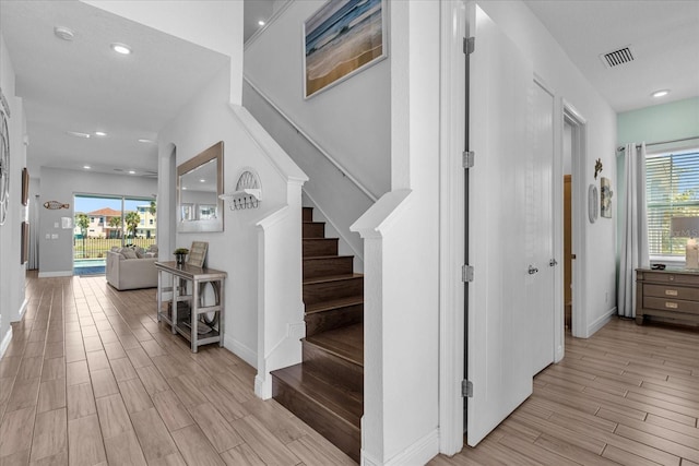 staircase featuring light hardwood / wood-style flooring