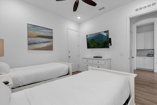 bedroom featuring ceiling fan and light hardwood / wood-style floors