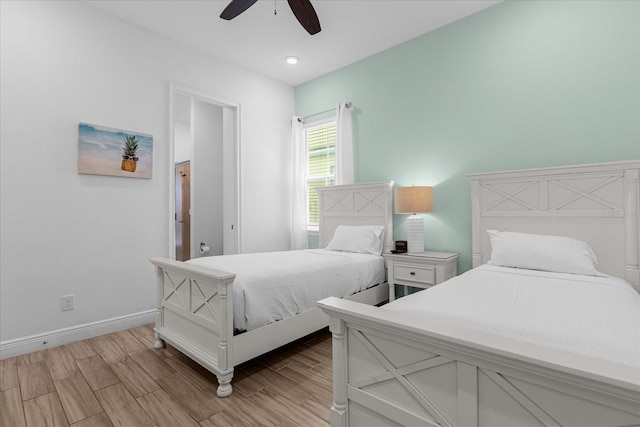 bedroom featuring ceiling fan and light wood-type flooring