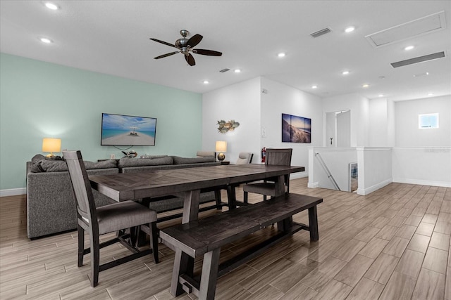 dining room with light hardwood / wood-style floors and ceiling fan