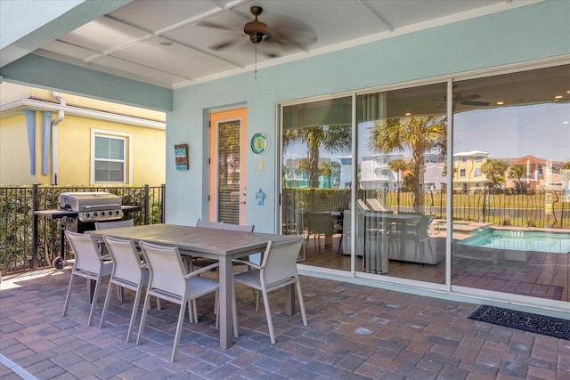 view of patio with a grill and ceiling fan