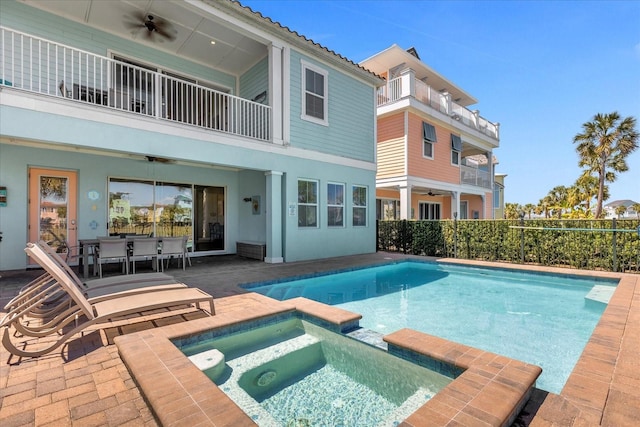 view of pool featuring ceiling fan, a patio, and an in ground hot tub