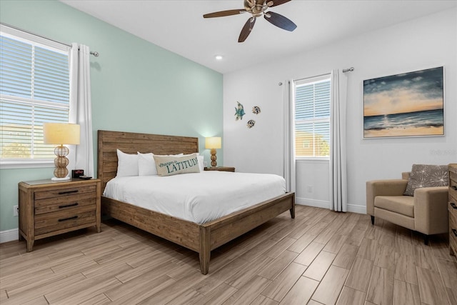 bedroom with ceiling fan and light hardwood / wood-style flooring