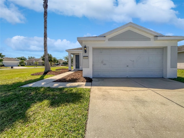 ranch-style home with a front yard and a garage