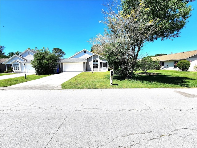 ranch-style home with a front yard and a garage