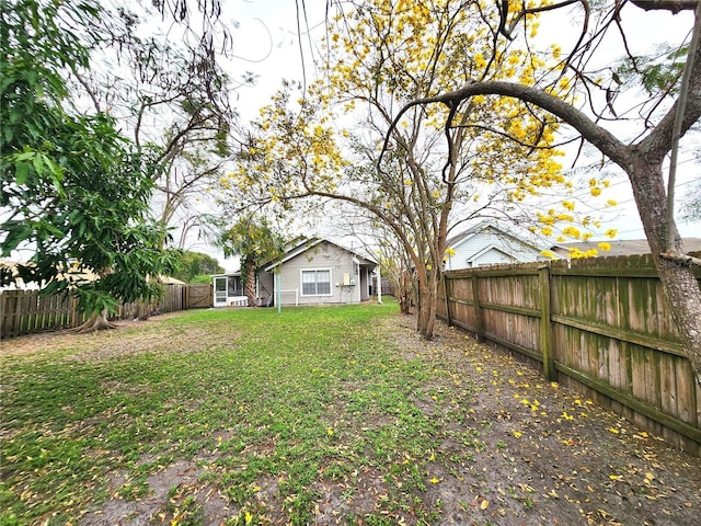 view of yard with a fenced backyard