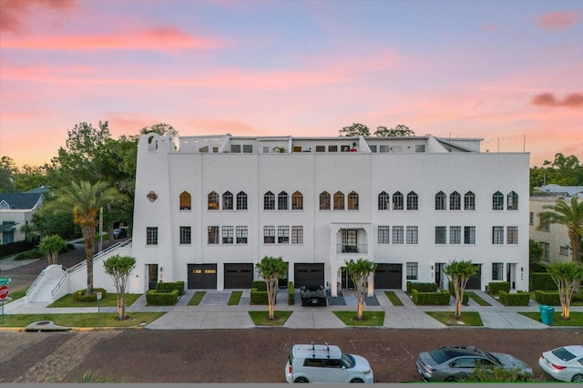 view of outdoor building at dusk