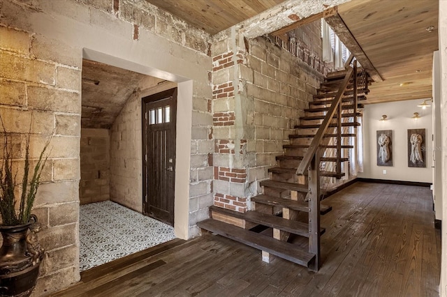 interior space featuring wood ceiling, wood-type flooring, and lofted ceiling