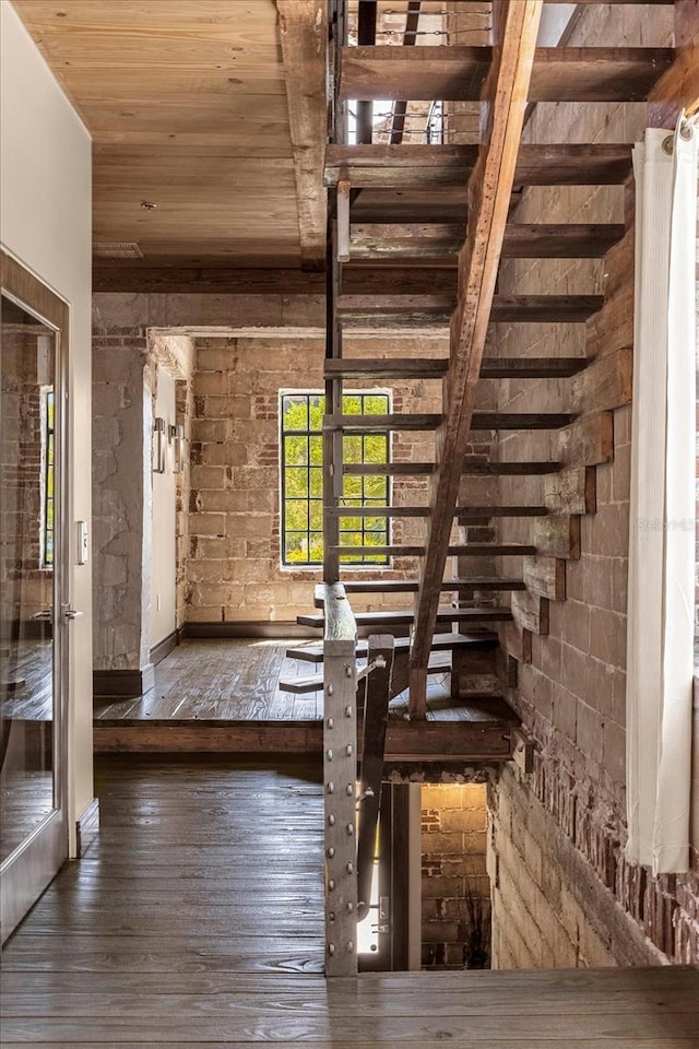 interior space featuring wooden ceiling and dark wood-type flooring